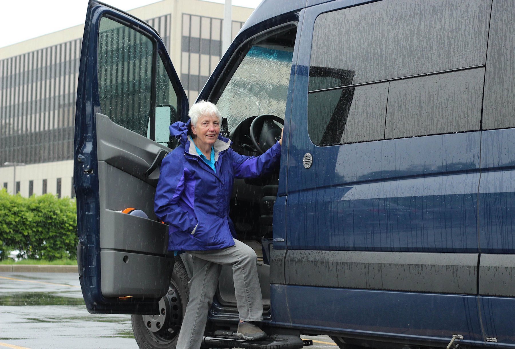 Diane in front of her van at Ohio State University